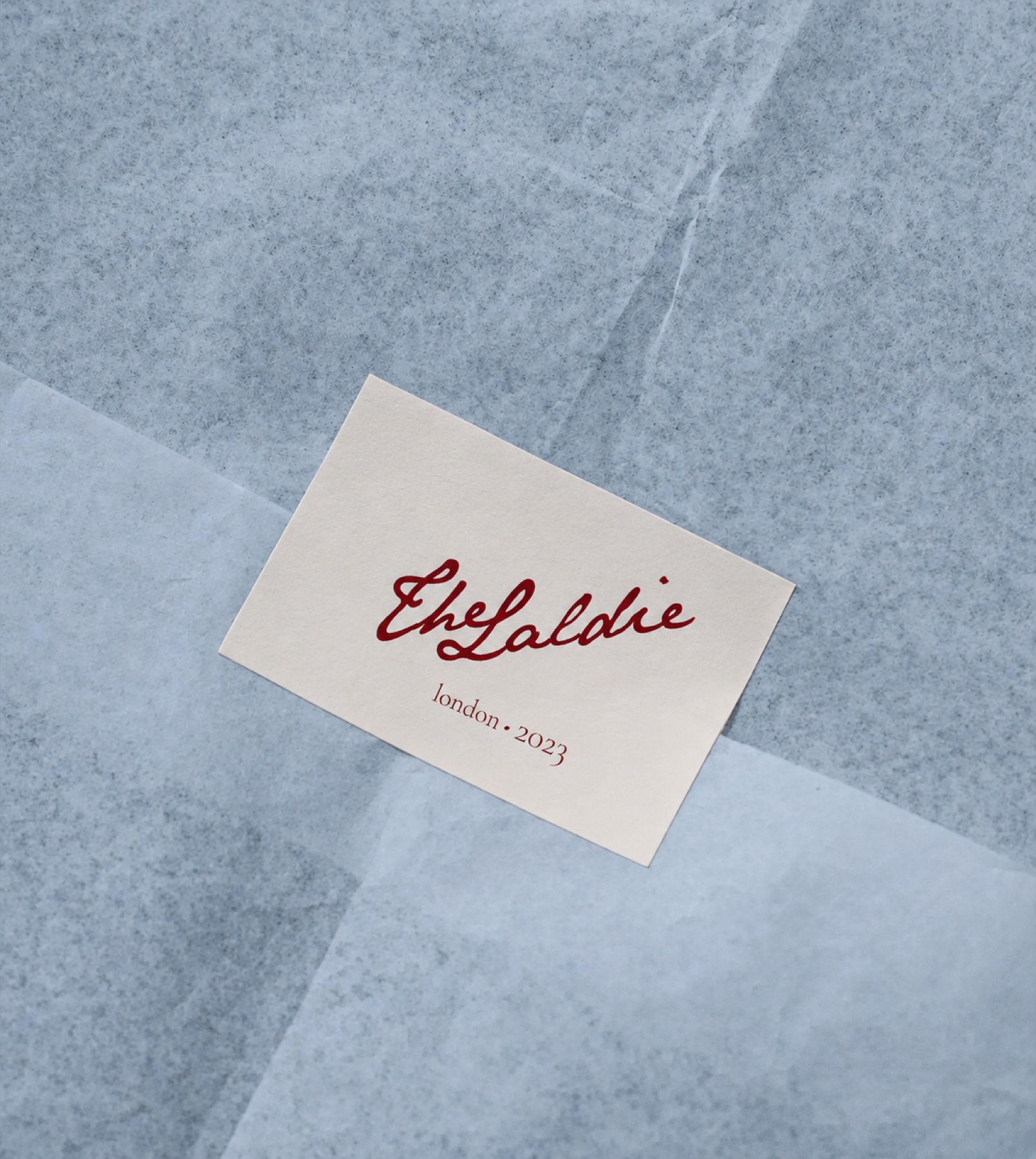 The Laldie calling card resting on pale blue tissue paper