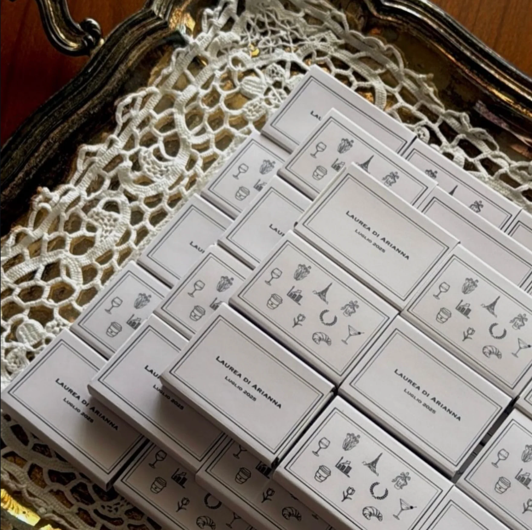 White matchboxes illustrated with Italian icons